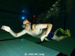 Practicing in the swimming pool. For the divers and for t... by John De Jong 